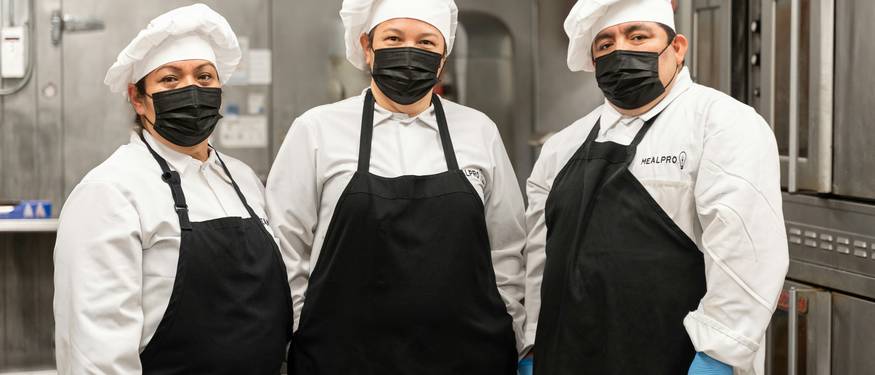 Ontario kitchen staff following food safety best practices with checklists and training