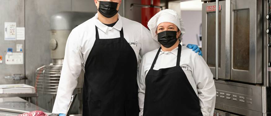 Ontario food service workers in a commercial kitchen following food safety certification requirements