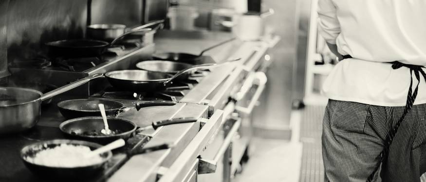 Ontario kitchen manager using a food safety inspection checklist during a daily compliance walk-through